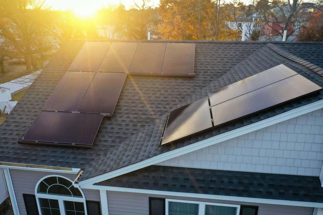 Solar financing - Go Solar With August: rooftop solar panels soaking up sunlight at sunset.