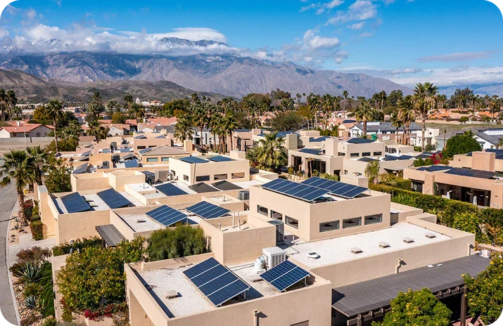 Maximum Solar System Size in Palm Springs California with solar panels on homes against a mountain backdrop.