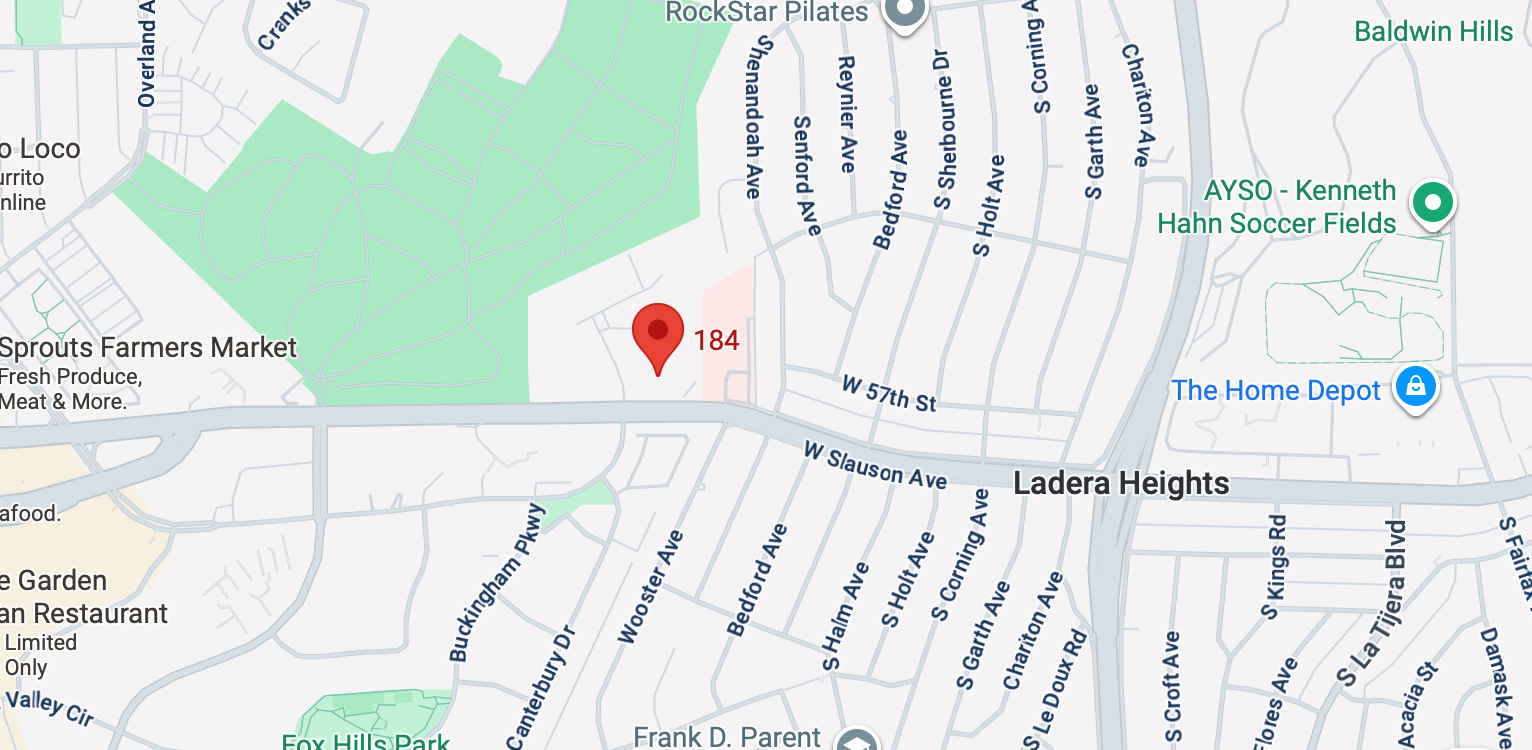 Map of a street with a red pin marking a location labeled '184'.